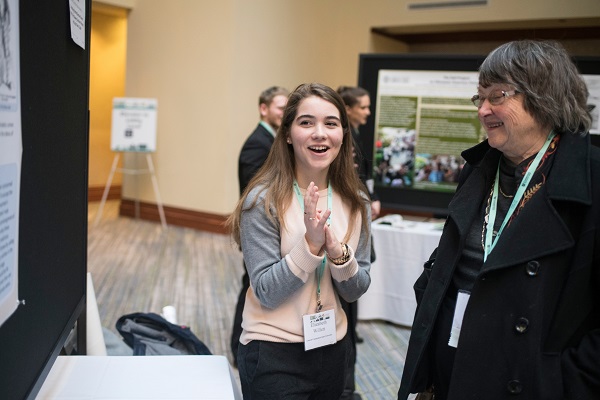Incoming AHA president Mary Beth Norton (right) grills Elizabeth Willett (Central Connecticut State Univ.) at the Undergraduate Poster Session.